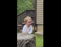 Little kid hides behind tree after guy destroys his stick 