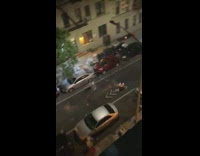 a few people play fight with fireworks street