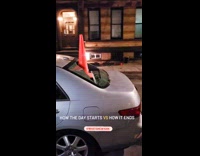 Car with tickets bow and traffic cone in window