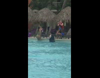 Girl creates water drop effect for photo  