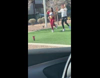 Three people tiktok dance in the middle of the park