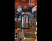 Woman takes selfies at restaurant