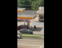 Guy behind car dance tiktok gasoline station