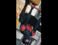 Spiderman hangs on yellow light guy selfie 