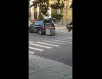 Stove on wheels attached at the back of car 