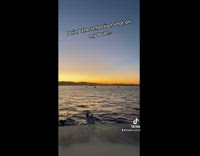 Reflection on boat looks like mirror sunset 