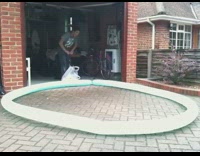 Boy pumps blue circle shaped balloon