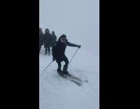 Man Trips on Ski and Falls on Snow