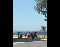 People hold spin around wedding couple drone