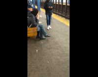 woman in black jacket eating popcorn