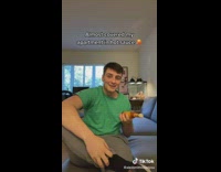 Guy green shirt flipping hot sauce around almsot drops it