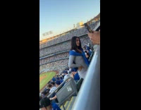 Collab IITW - Woman gray outfit poses baseball seats isle