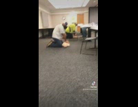 Collab BitchMP - Group of people in CPR class pushing in dummies