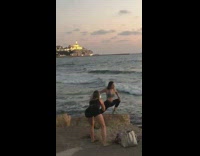 Grey sports bra girl lunge pose rock 