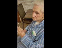 Senior citizen enjoys a candy bar and hides who he got it from