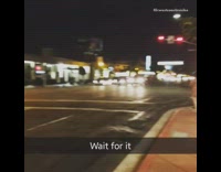 guy sitting down on street throws up