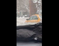 Taxi driving opposite way in snowstorm