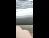 Tesla cars on the street surrounds the filmer in his car