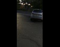 Silver SUV car parked diagonally parking spots 