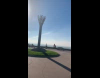 Young girl pretend to fall on cliff