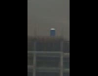Porta potty on top of construction site building