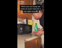Guy tries to quietly microwave midnight snack 