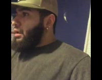 Guy fights green hat and puts him to sleep on bed