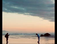 Collab IITW - Man walks backward at beach shore shoot