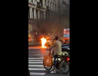 Street and taxi both on fire