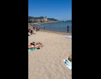 Woman in bikini walks for beach video