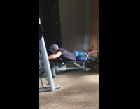 Guy dad blue shorts hat gym practicing surf paddle standing up