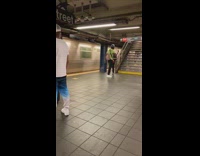 Green shirt guy dances alone subway station 
