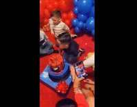 Boy gets pushed on the cake and hits the wrong kid