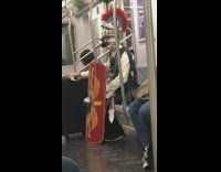 Man dressed as knight red shield