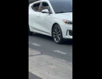 White mask on car passenger seat headrest