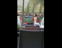 girl orange sweater wine weird face