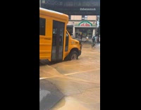 Collab WINY - Bus tire fell in hole covered by flood