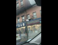 Woman sits on shoulders to change sign 