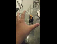 Guy pretend to control lid on table