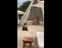 Woman pink dress bikini pictorial beach tent