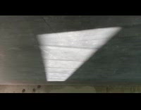 Water reflection moves around concrete ceiling projector 