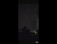 Lightning and flashing lights on night sky