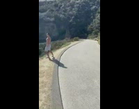 Shirtless guy flexes for photo