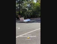 Guy drives customized bed stroll at park