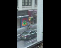 Person Dances as it Holds Pet Dog