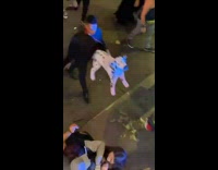 Woman drunk and falling on street with dog balloon