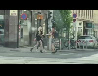 Two women fashionista model video shoot sidewalk