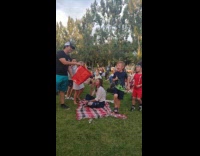 Bunch of people give and throw money inside the paper bag