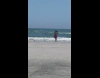 Woman carried by a man at the beach