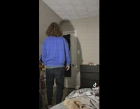 Guy shakes butt while walking towards door 